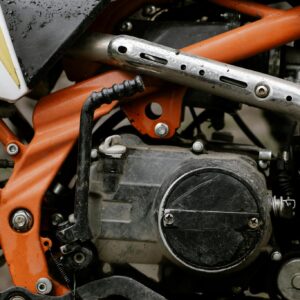 Detailed close-up of motorcycle engine showcasing mechanical components and craftsmanship.