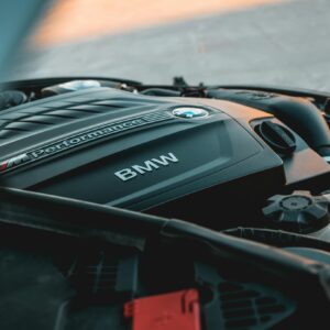 Detailed view of a BMW engine cover, showcasing automotive technology.