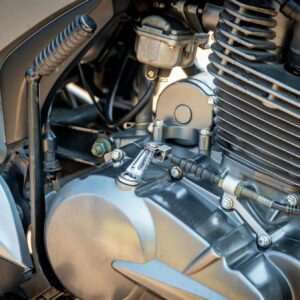 Detailed view of a motorcycle engine showing components and metal textures.